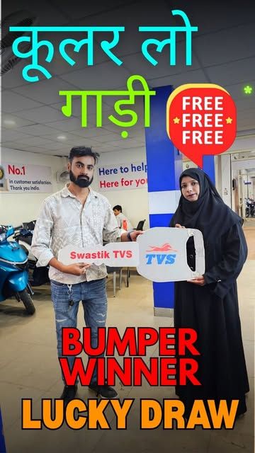Pankaj Electronics bumper lucky draw winner receiving a scooter key